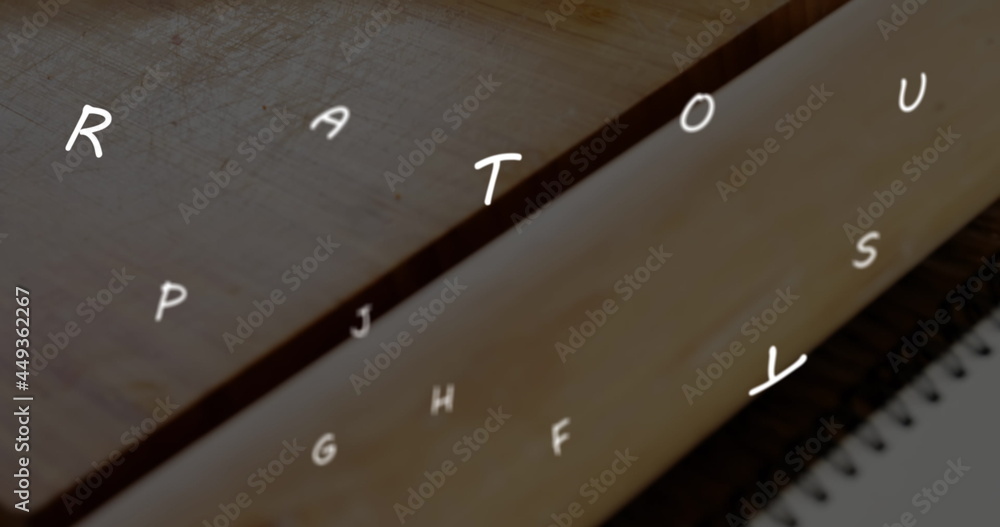 Poster image of floating letters over a pen lying on a notebook