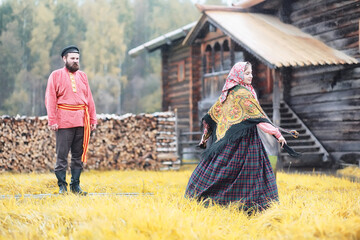 Traditional Slavic rituals in the rustic style. Outdoor in summer. Slavic village farm. Peasants in...