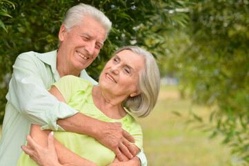 Porait of senior couple posing in the park