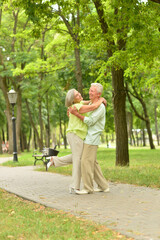 Porait of senior couple dancing in the park