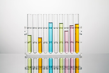 test tubes with color liquid in a  acrylic stand. science and medical concept. - obrazy, fototapety, plakaty