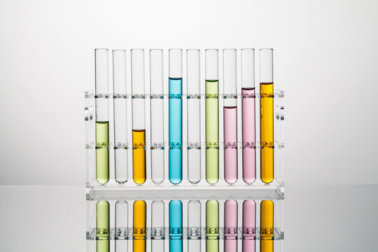 test tubes with color liquid in a  acrylic stand. science and medical concept.