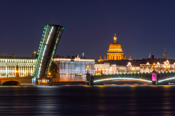 Open Troitsky (Trinity) bridge, Marble palace and St. Isaac's cathedral dome at night, Saint Petersburg, Russia