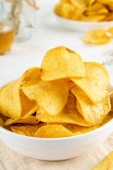 Potato chips are thin strips of potato that are deep fried or baked until crisp. Potato chips are generally served as an appetizer or snack.
