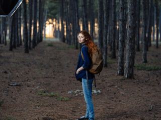 Naklejka na ściany i meble pretty woman hiker backpack forest nature walk freedom