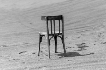 Lonely chair in the desert in black and white