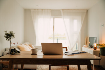Freelance podcaster simple home set up with laptop