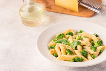 Pasta with green peas, broccoli and parmesan cheese.