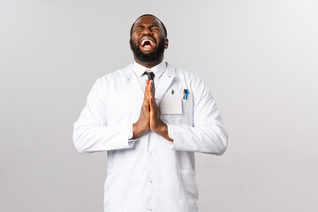 Desperate african-american doctor, pleading begging god mercy, press hands in pray crying heart out, close eyes and showing up sky, wear white coat, supplicating for people stay safe covid19 pandemic - obrazy, fototapety, plakaty