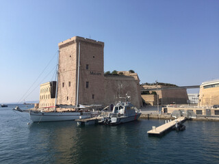 Fototapeta na wymiar The Fort Saint Jean with the large square Tower of King René, one of the most visited monuments in Marseille. It is connected to the former port by a footbridge.