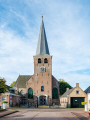 Fototapeta na wymiar Building of Mauritiuskerk, church with tower in IJlst, Friesland, Netherlands