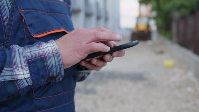 Close up man's hands that hold phone