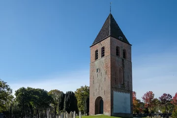 Deurstickers The cemetery of Joure, Friesland with medieval church tower, Friesland province, The Netherlands © Holland-PhotostockNL