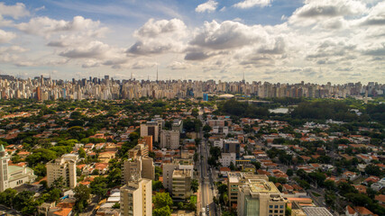 Fototapeta na wymiar Aerial view of Sao Paulo city. Prevervetion area with trees and green area of Ibirapuera park in Sao Paulo city, Brazil