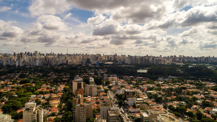 Fototapeta premium Aerial view of Sao Paulo city. Prevervetion area with trees and green area of Ibirapuera park in Sao Paulo city, Brazil