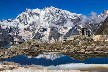 Beautiful view of Monte Rosa with snow and Lago Smeraldo in the summer season in Valle Anzasca, Piedmont, Italy