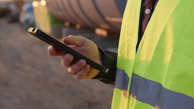 Close up view of man's hand that holds smartphone