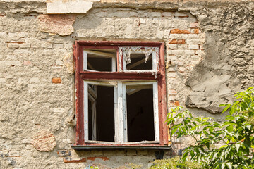 window of old abandoned house in the city