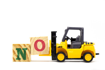 Toy forklift hold letter block o to complete word no on wood background