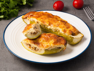 zucchini stuffed with meat under a cheese crust