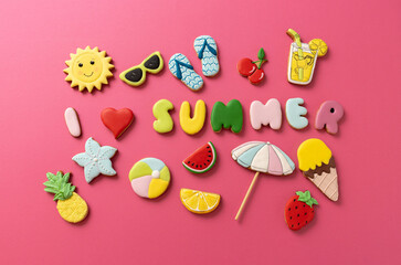 I love summer sugar icing cookies in beach theme shapes on pinkish background