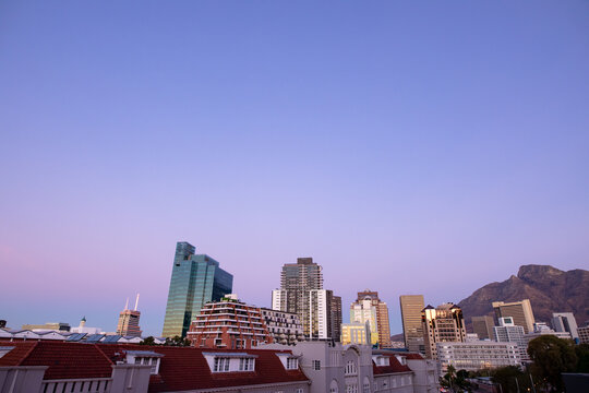Modern high rise buildings in built up business district of modern city with dusk sky