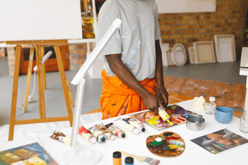 African american male painter at work in art studio