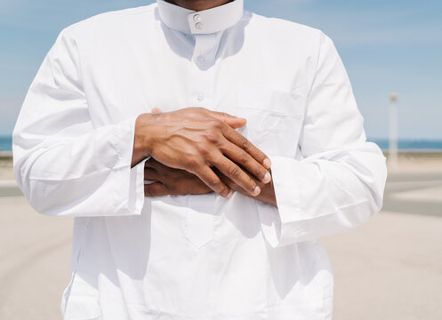 Muslim man praying on beach