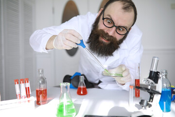 Chemist crazy. A mad scientist conducts experiments in a scientific laboratory. Performs research...