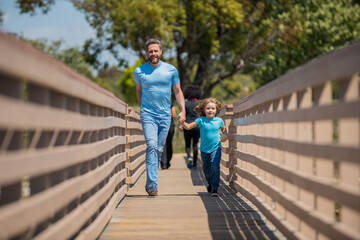 parent relax with little child boy. dad with kid on summer day. parenting and fatherhood.