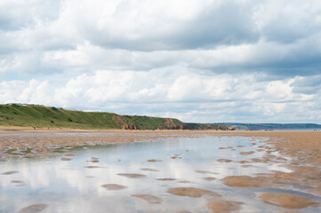 North Sea at the Crimdon beach, Hartlepool and Seaton Carew, England. Dark blue sky and sandy beach in United Kingdom
