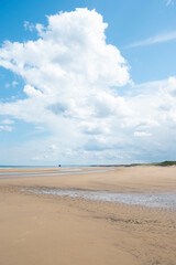 Fototapeta na wymiar North Sea at the Crimdon beach, Hartlepool and Seaton Carew, England. Dark blue sky and sandy beach in United Kingdom