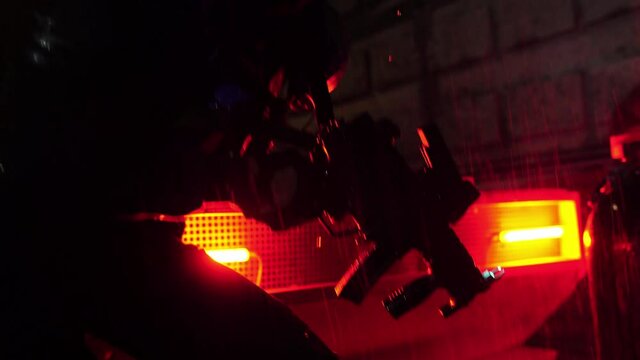 Cyberpunk future. Police officer halfman bionic cyborg is looking for intruder fugitive or illegal immigrant near futurictic car at night. Rain. Science fiction scene, fantasy. World of tomorrow