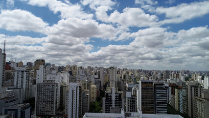 Obraz na płótnie Canvas Residential building under construction in the Jardins region, São Paulo. Aerial view. Many buildings in background