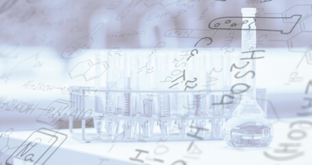 Chemical structures and equations floating over chemistry equipment in school laboratory