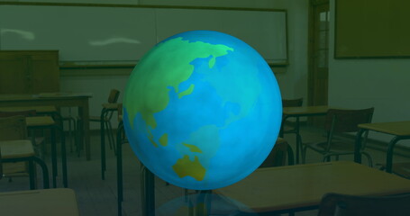 Digital composition of changing numbers and alphabets over spinning globe against empty classroom