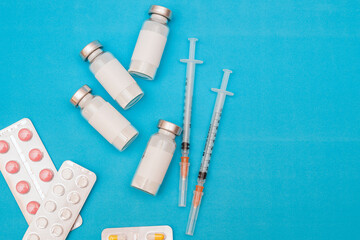 vaccine, medicine, vial, syringe for injection. Vaccination, treatment for coronavirus Covid 19. Unbranded