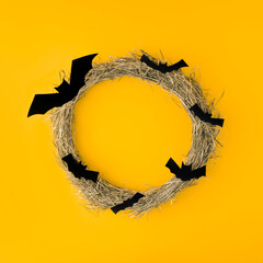 Creative look made of autumn tree branches with bats. Minimum flat laying. Halloween concept. On a...