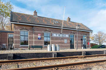 Fototapeta na wymiar Historic wall advertisement at Station Twisk (1887) op de lijn Hoorn-Medemblik, Noord-Holland Province, The Netherlands