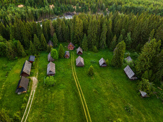 Obraz na płótnie Canvas Traditional Shepherd Log Cabin Hut Village in Jurgow, Podhale in Poland. Drone View