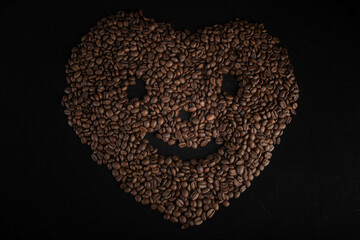 Coffee beans in heart format with a happy face
