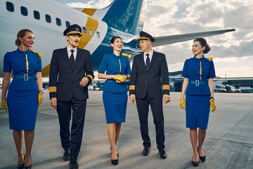 Flight attendants and pilots enjoying each other company