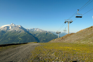 Chairlift suspended, empty. Ski lifts at a standstill, in the ski resort in summer.