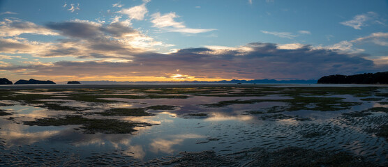 Fototapeta na wymiar Sunset over water in New Zealand