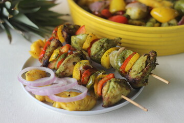 Chicken pineapple kebab. A dish of pieces of chicken and bell peppers marinated with coriander...
