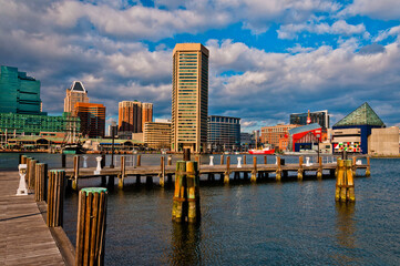 Fototapeta na wymiar Photo of Baltimores Inner Harbor Featuring the World Trade Center and the Aquarium