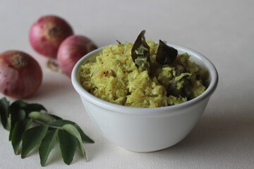 Stir fried onions with grated coconut, green chillies and curry leaves. A tasty side dish for Kerala meals.