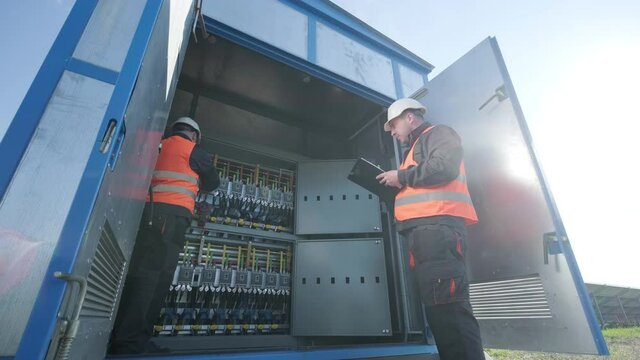 Checking the operating voltage levels of the solar panel switchgear compartment