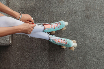 Mint roller skates on the legs