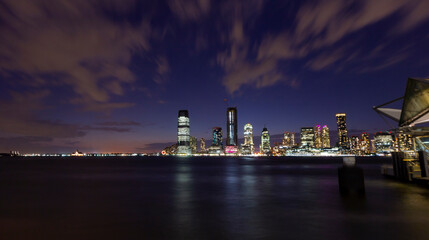 Obraz premium A panorama picture of Manhattan skyline at night with One World Trade Center